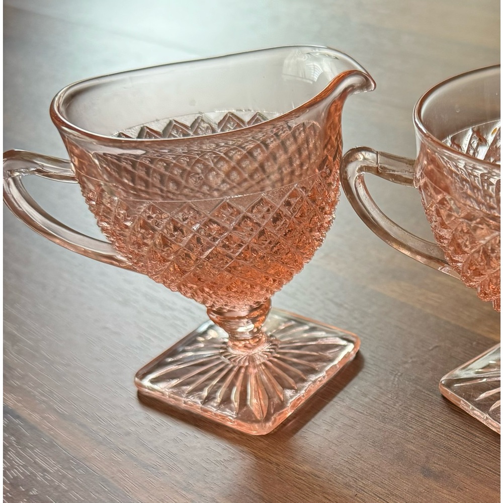 Pink glass creamer and sugar bowl.